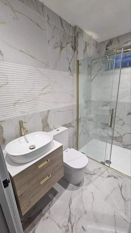Bathroom plumbing renovation with shower vanity and toilet by Dudley's Plumbers