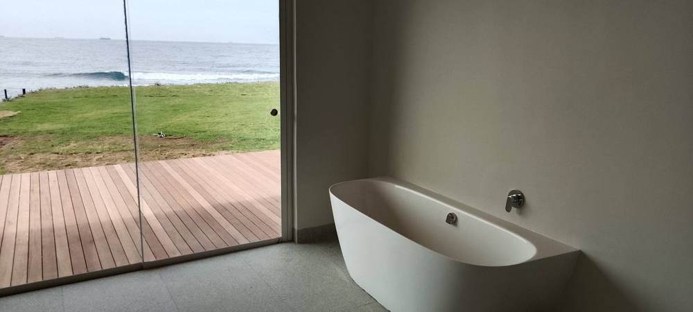 Luxury bathroom plumbing renovation with ocean view — Dudley's Plumbers