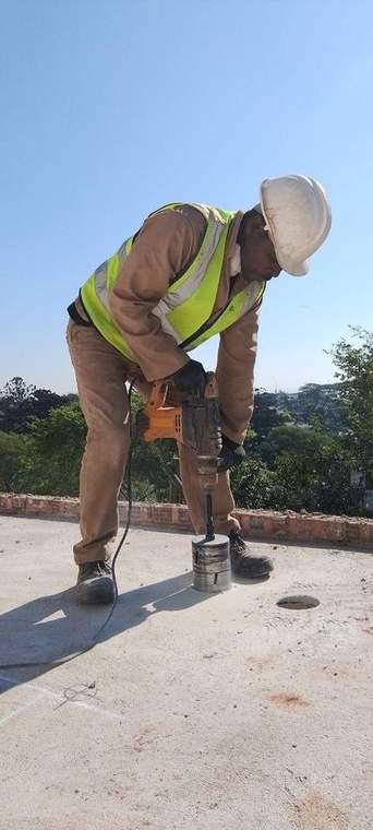 Team coring concrete slab for sewer and waste pipes by Dudley's Plumbers