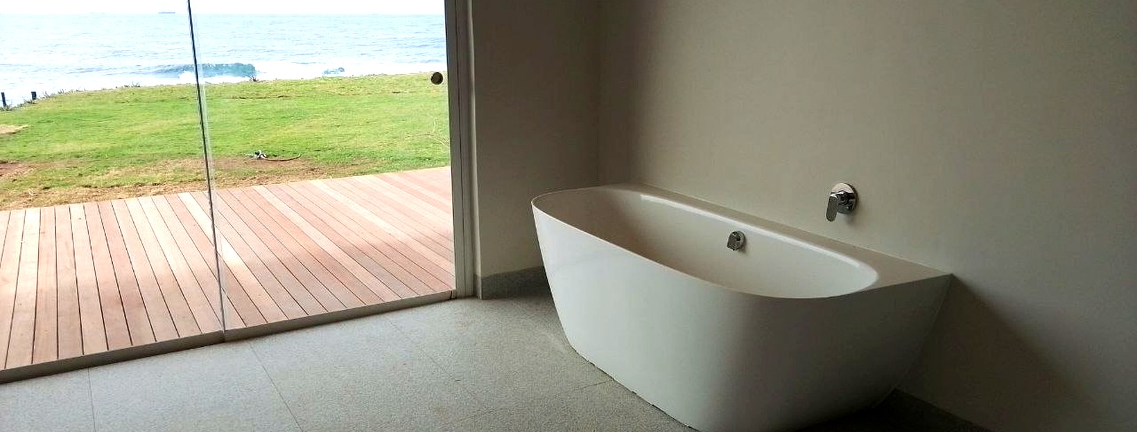 Coastal bathroom with ocean view — Dudley's Plumbers Umdloti